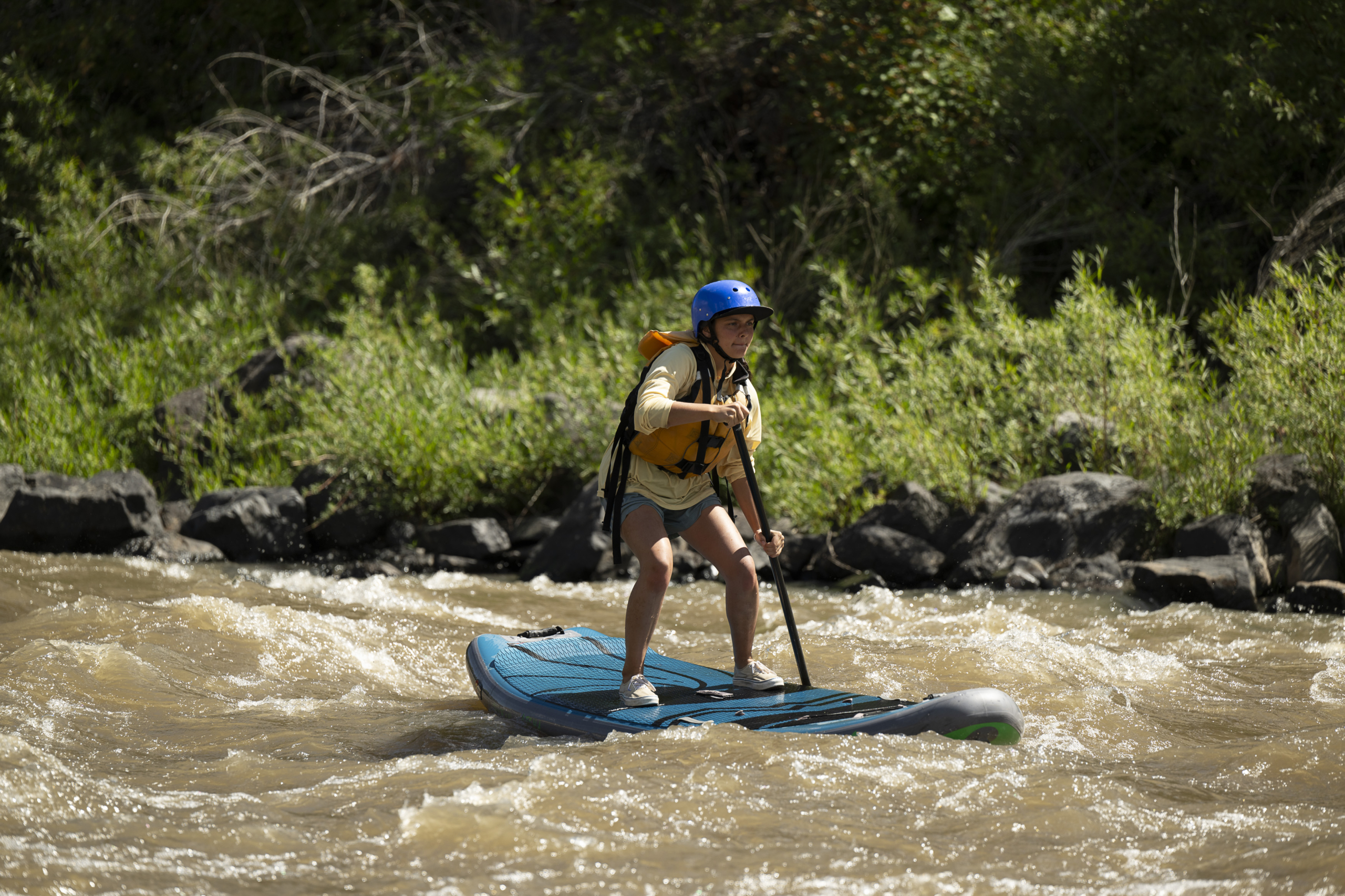 Family paddling tandem kayak on Lake Dillon with mountain backgrounds