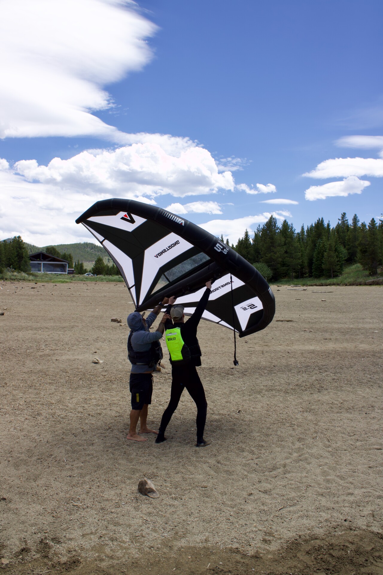 Foiling student with handheld wing on Lake Dillon