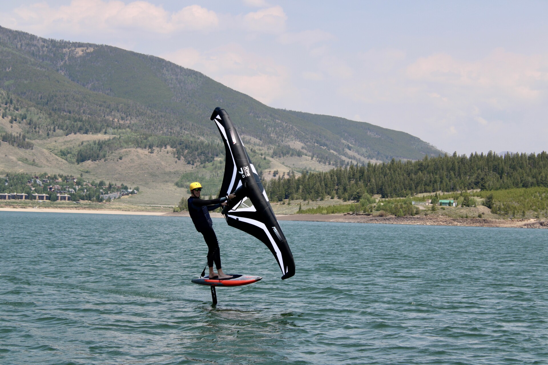 Wingfoiling rider practicing turns on Lake Dillon