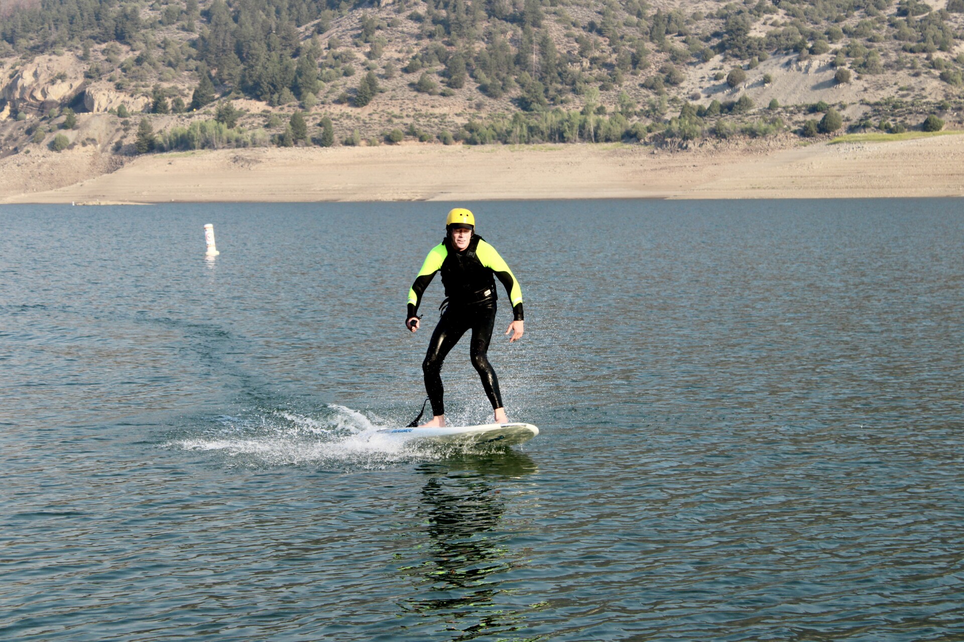 Wingfoiling rider on foil board in Summit County Colorado
