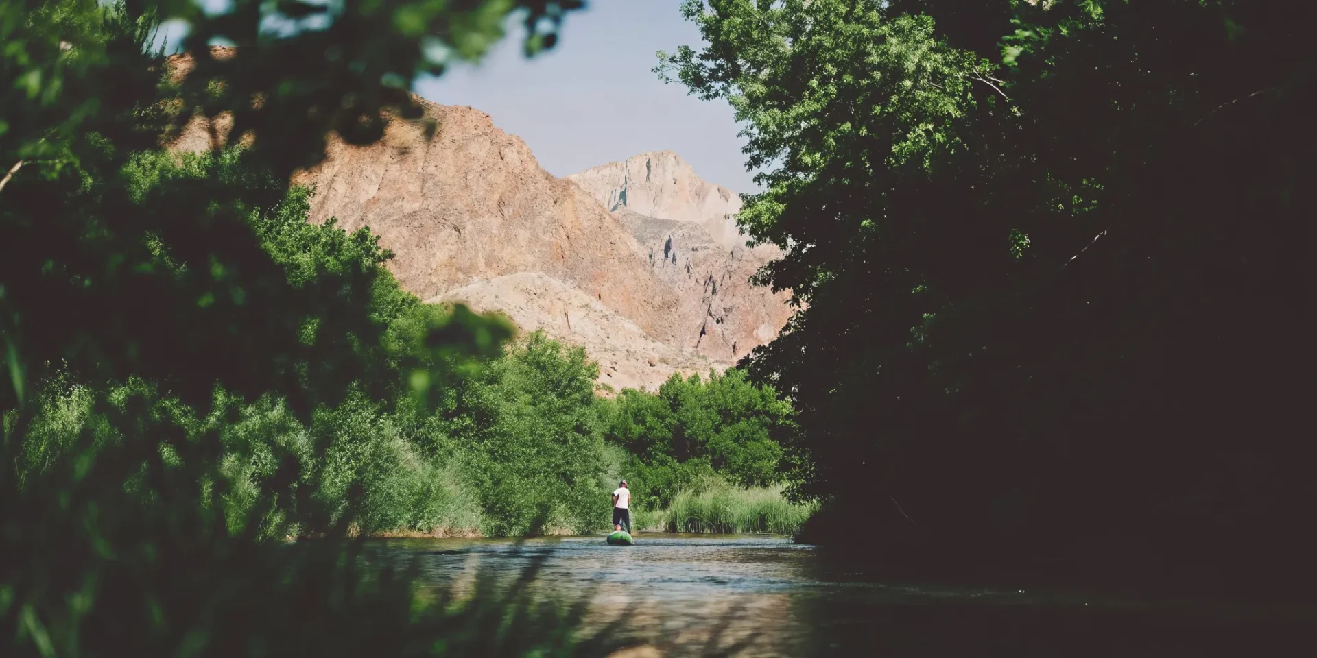 Paddleboarder on a scenic Colorado river