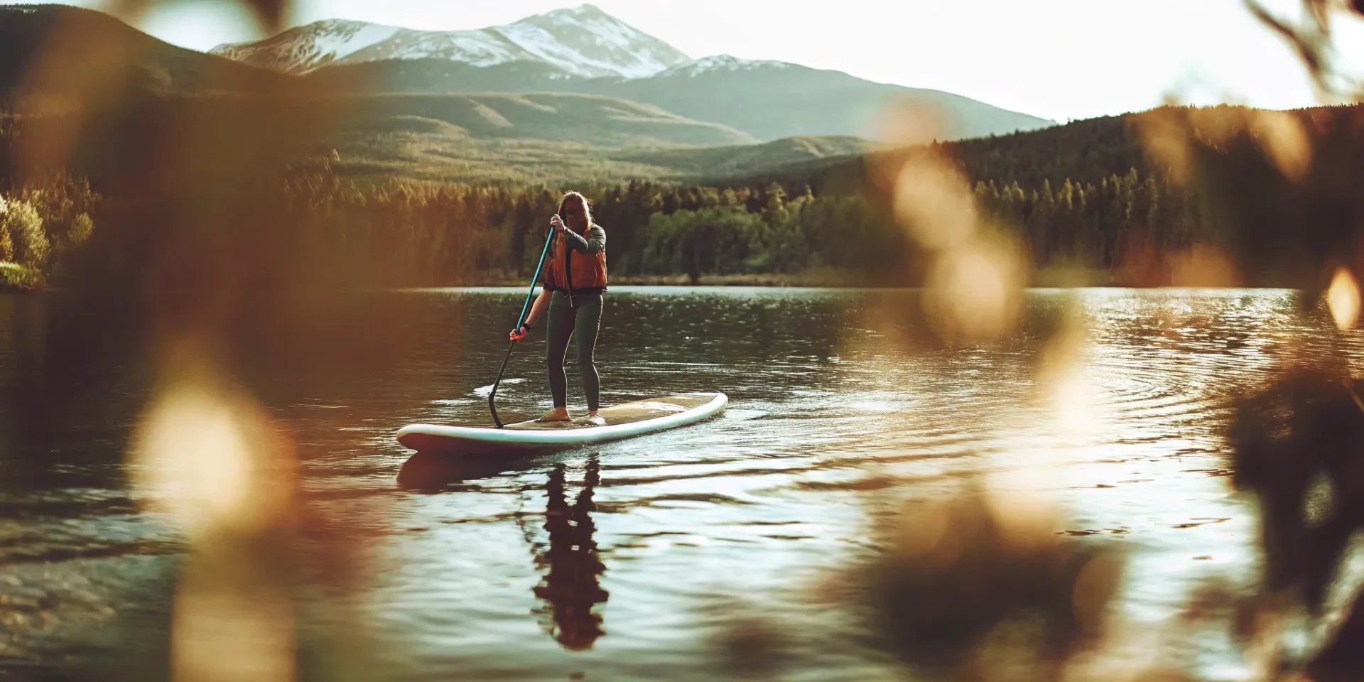 Paddleboarder on an alpine lake near Dillon, Colorado