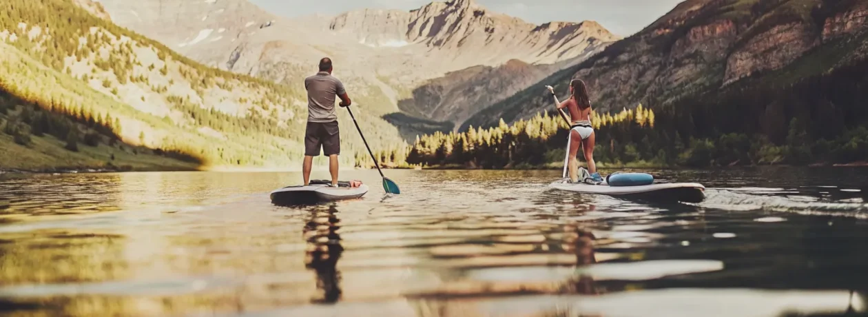 Paddleboarders enjoying a clean Colorado mountain lake