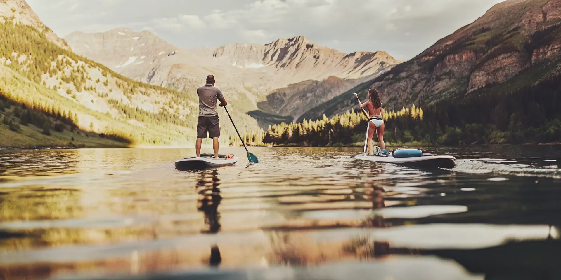 Paddleboarders enjoying a clean Colorado mountain lake