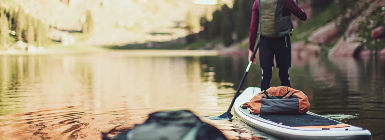 Prepared paddleboarder with gear for what to bring paddle boarding Colorado mountains