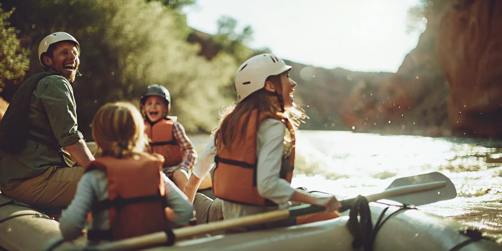 Family rafting on the Upper Colorado River near State Bridge with life jackets and helmets