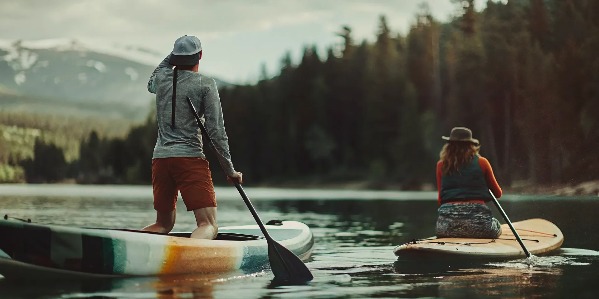 SUP board and kayak on Lake Dillon with mountain views